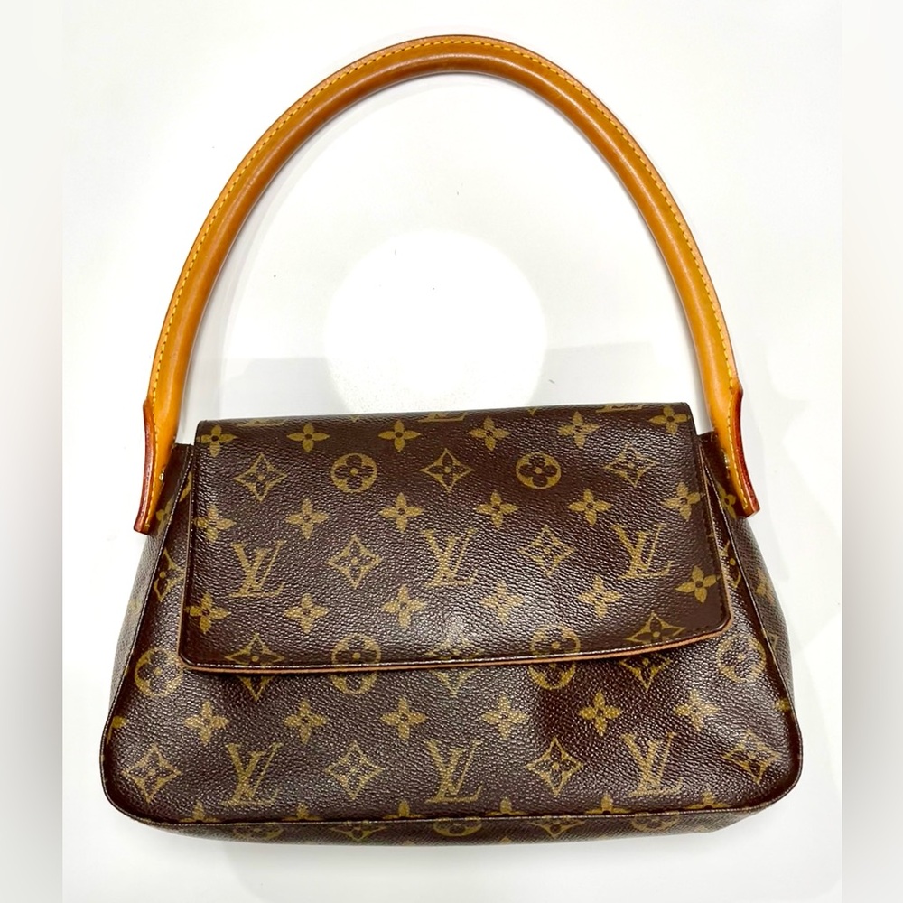 Authentic Louis Vuitton Monogram Mini Looping shoulder bag.